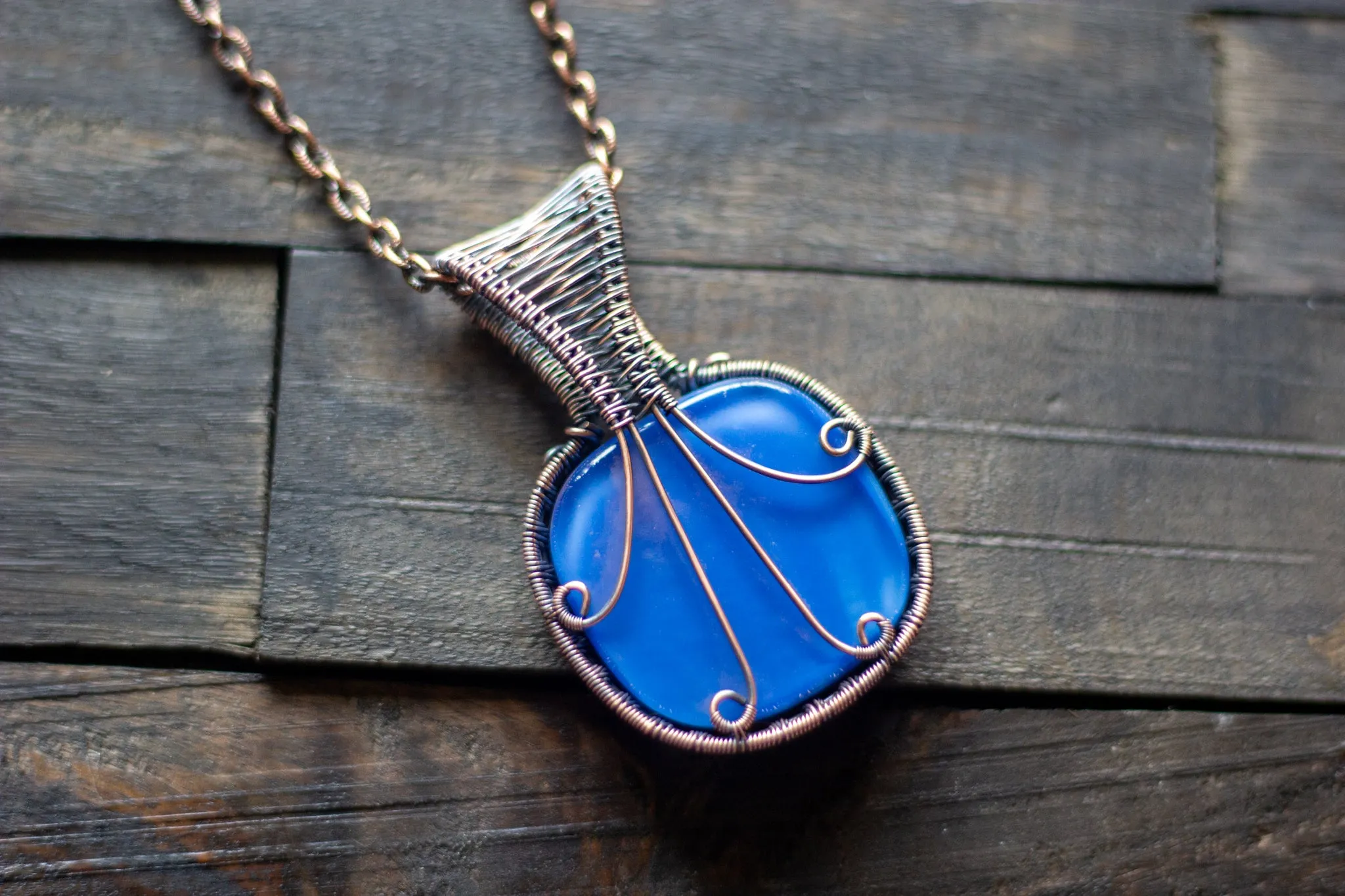 Copper Wire Wrapped Pendant with Snowflake on Streaked Blue Fused Glass