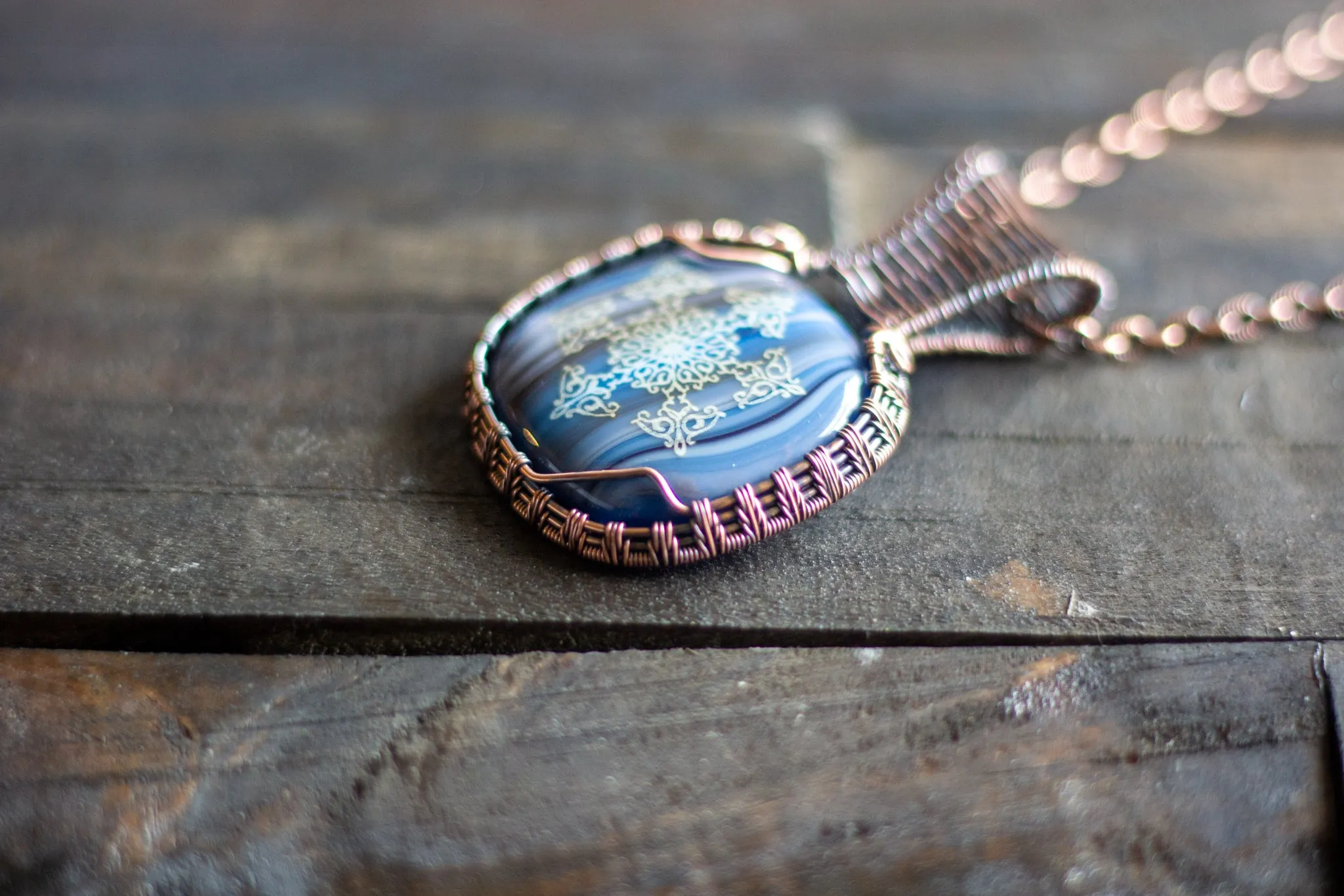 Copper Wire Wrapped Pendant with Snowflake on Streaked Blue Fused Glass