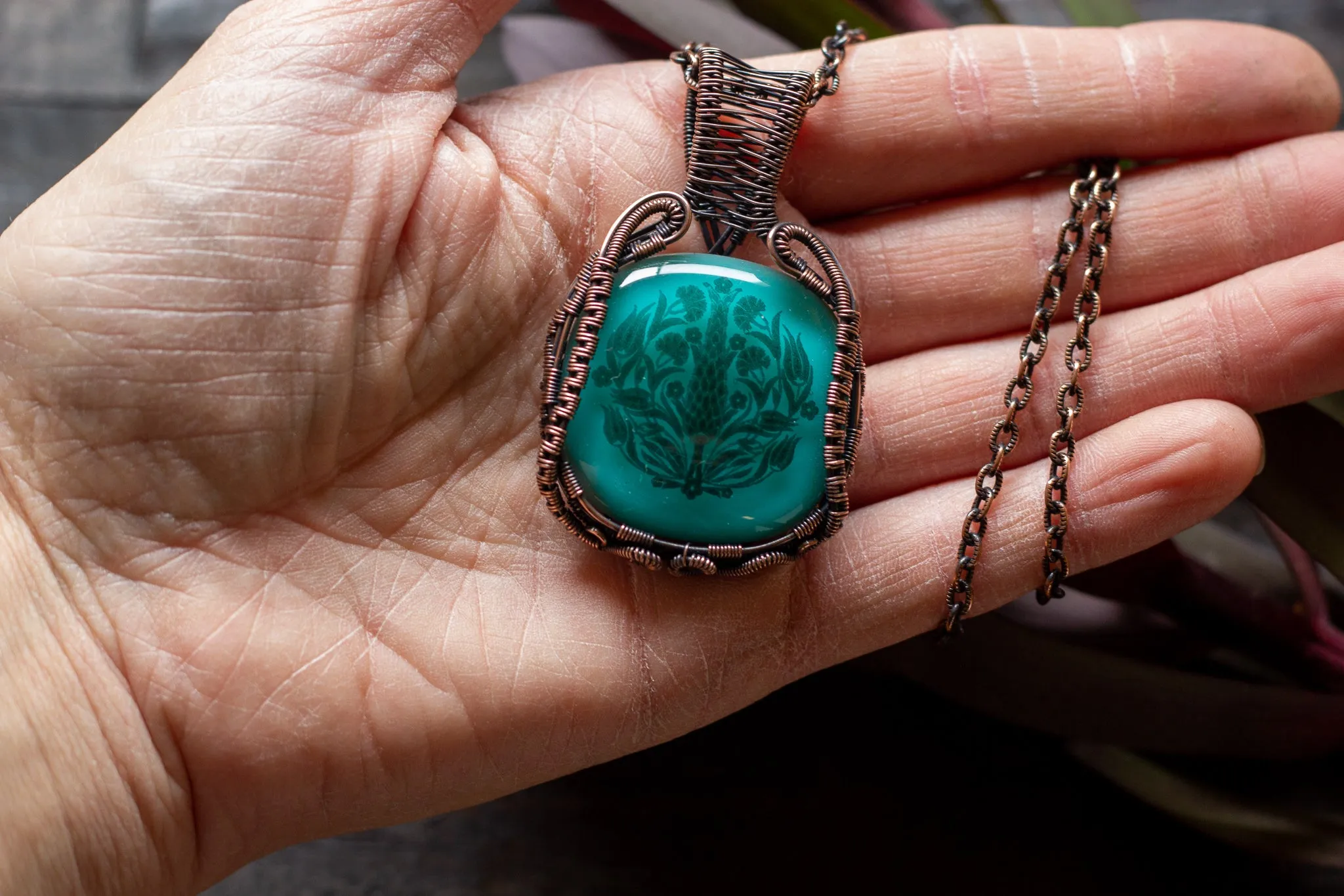 Copper Wire Wrapped Pendant with Stylized Flowers on Teal Fused Glass