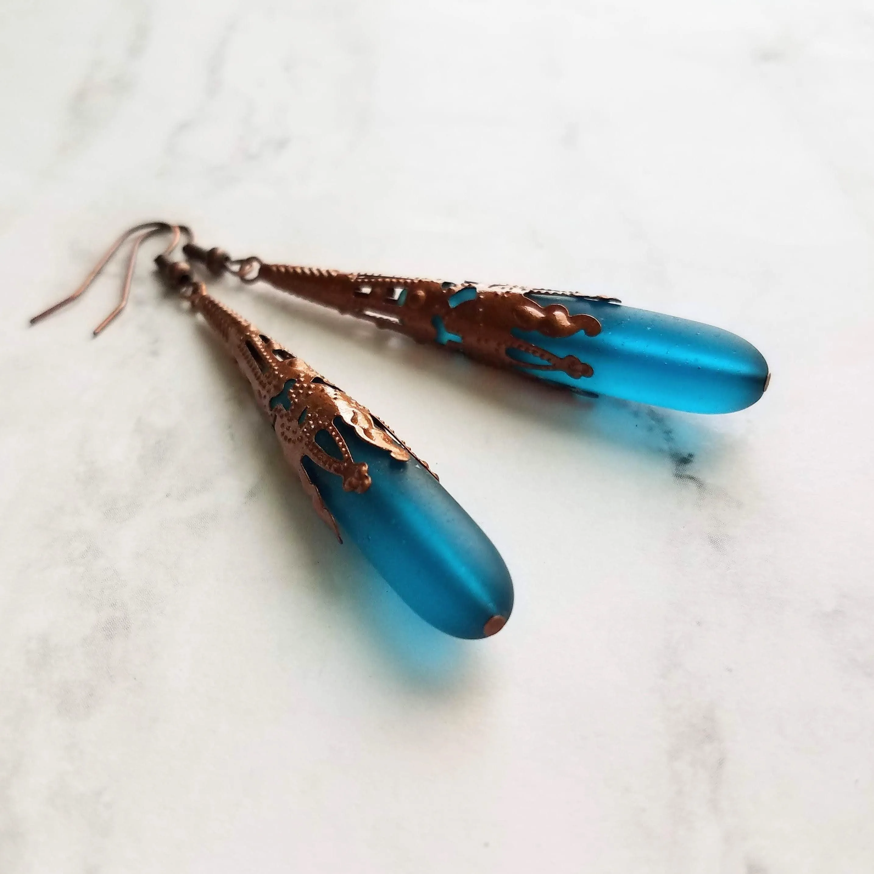 Long Copper Sea Glass Earrings - frosted elongated narrow teal blue teardrop in ornate lacy filigree oxidized antiqued thin cone wrap 3 inch
