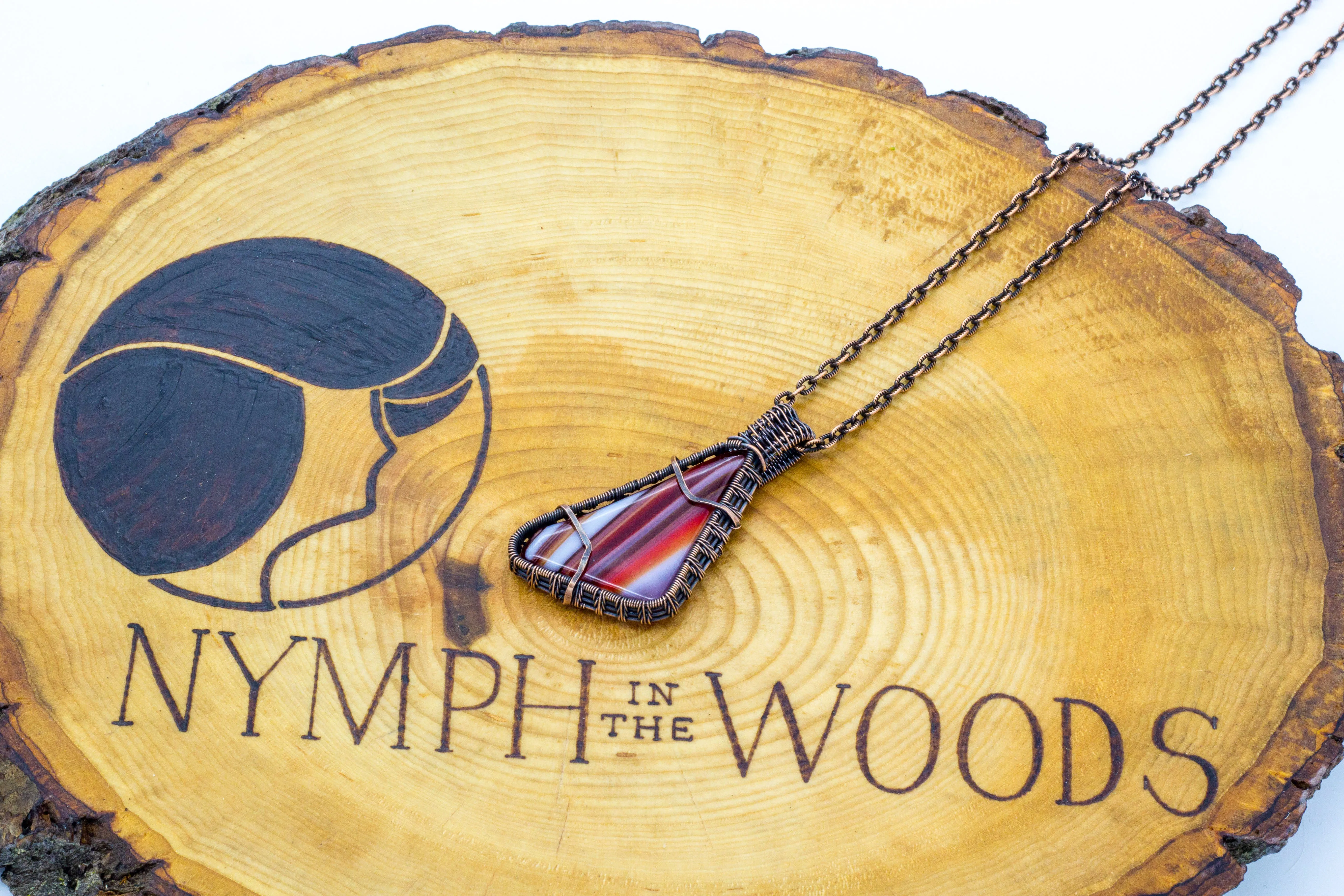 Streaked Red and White Fused Glass Pendant with Copper Wire Wrapping