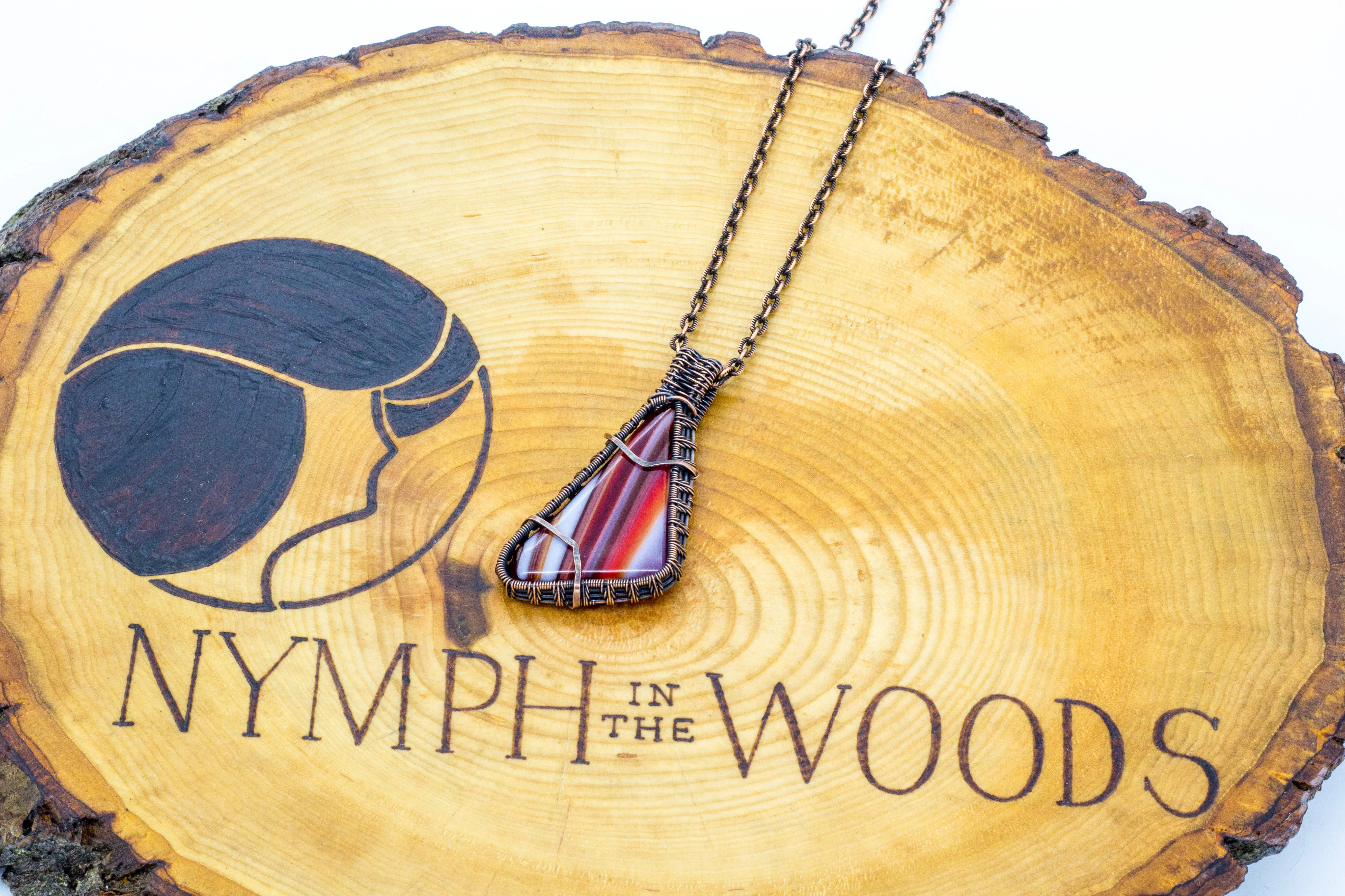 Streaked Red and White Fused Glass Pendant with Copper Wire Wrapping