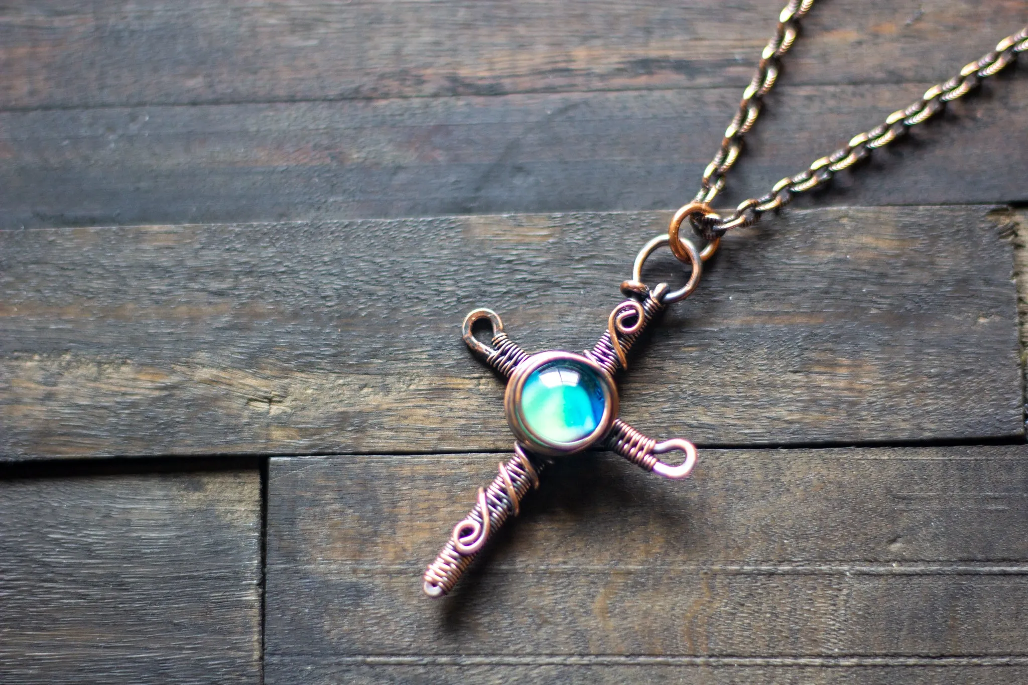 Woven Copper Cross with Light Blue Fused Glass Accent